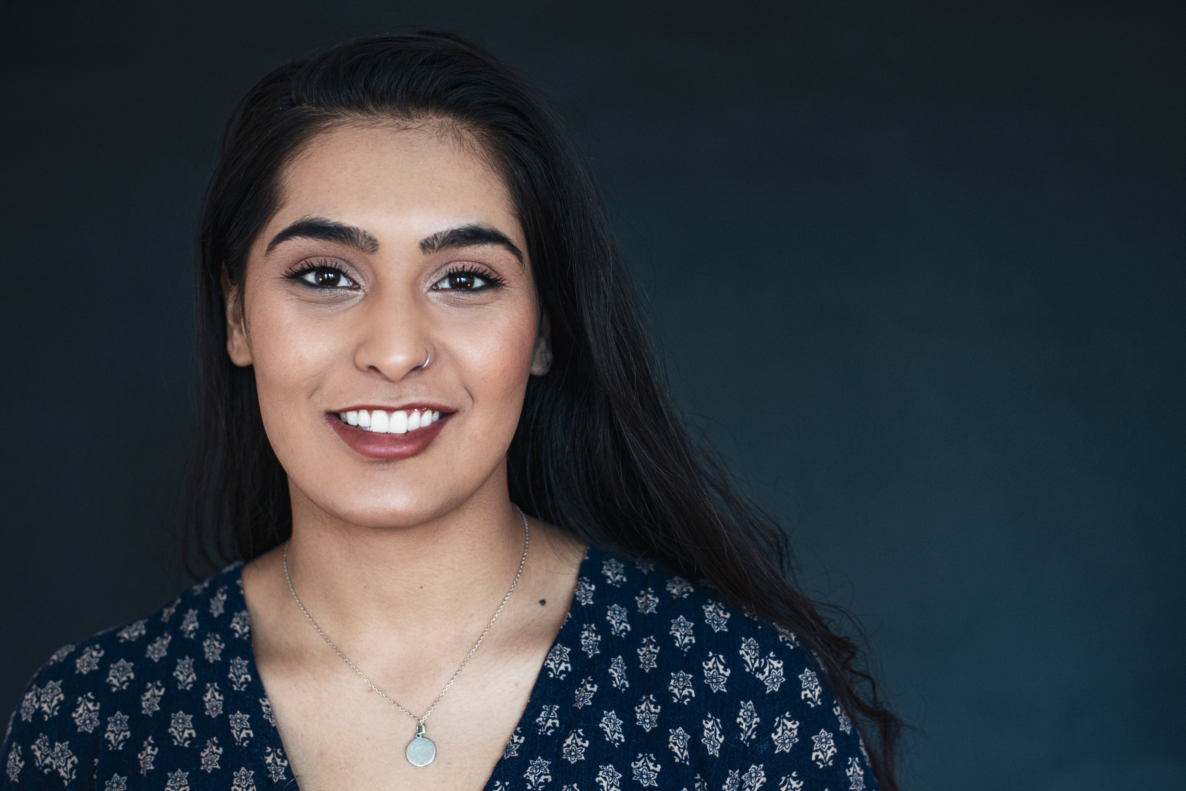 files/young-woman-in-blue-smiling.jpg